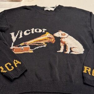 Black Crewneck Sweater with Dog and Phonograph Design hole in arm  pit.